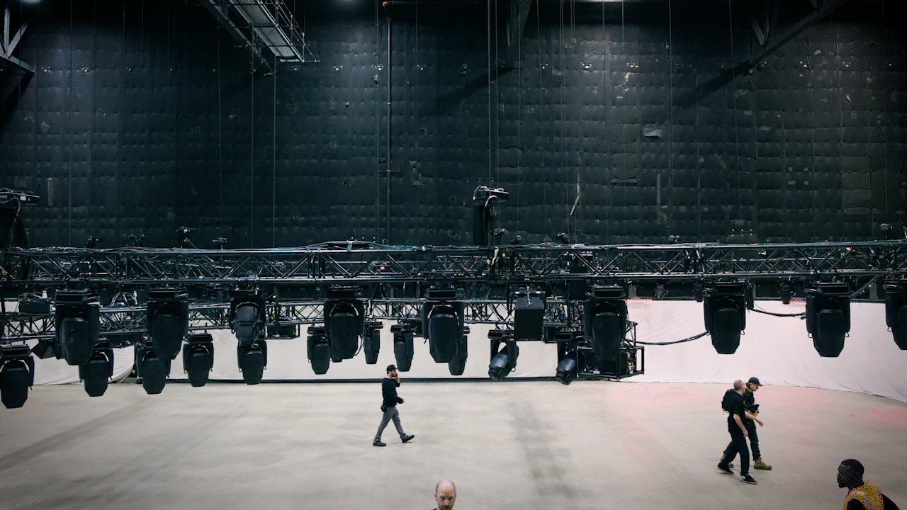 Lighting and rigging installation for a corporate event production.