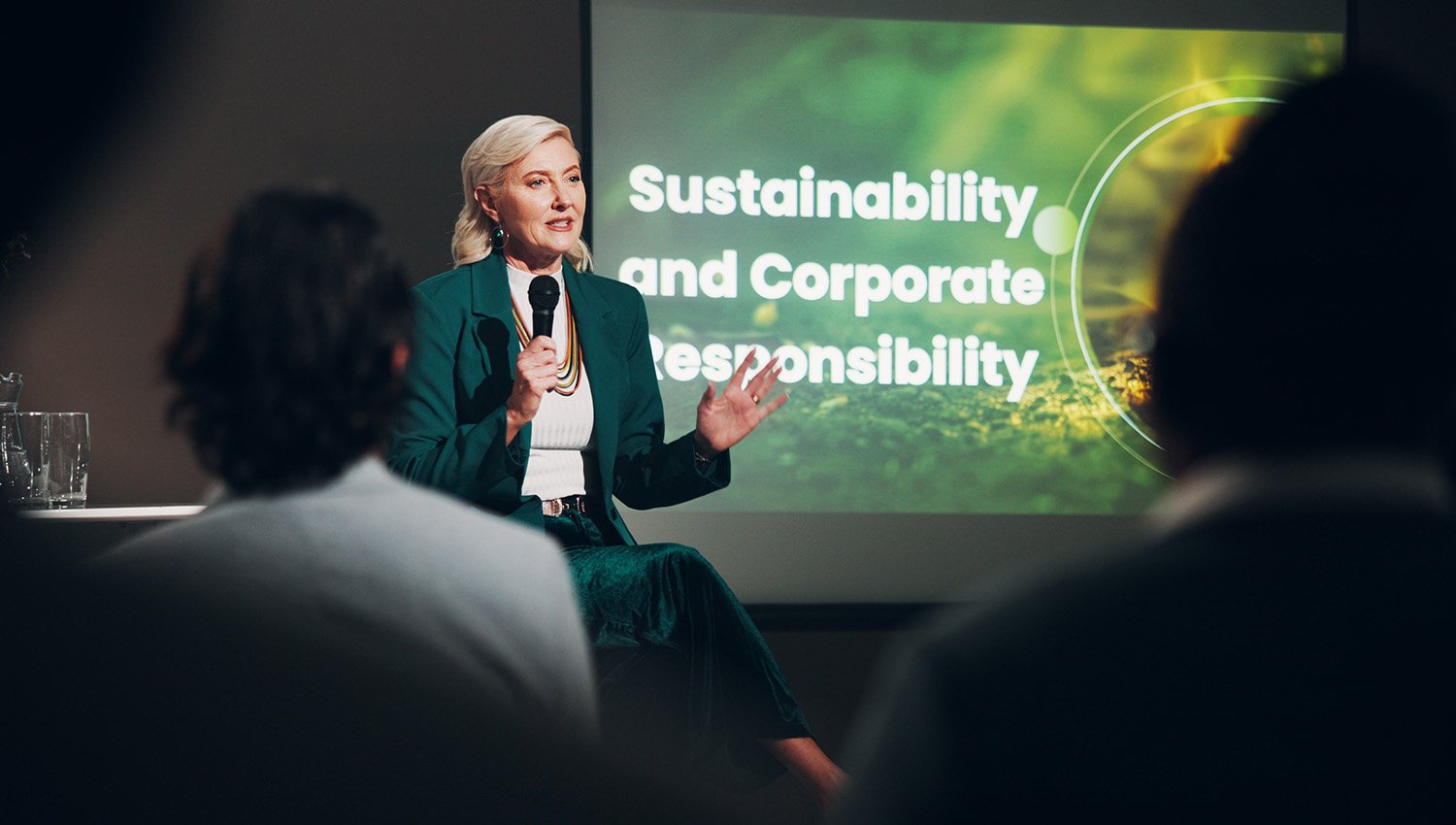 Speaker presenting at a professional conference.