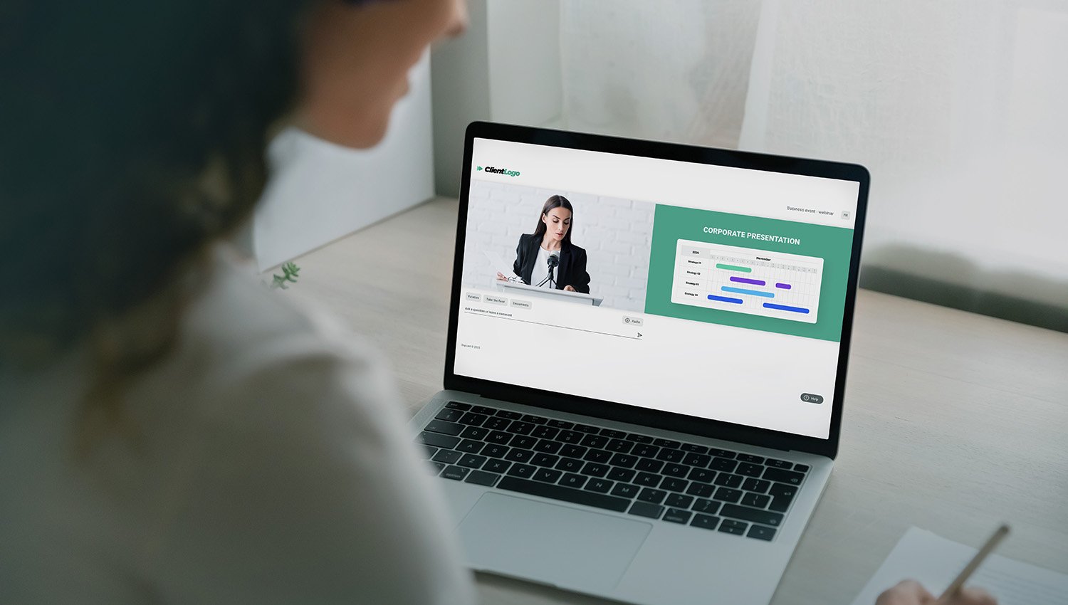 Employee participating in a virtual meeting on a laptop.