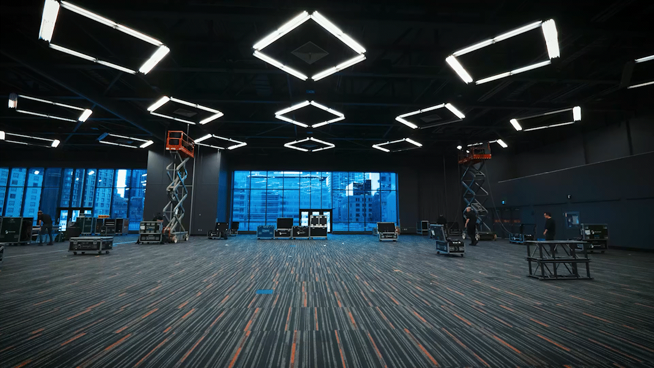 Corporate event venue being prepared before production.