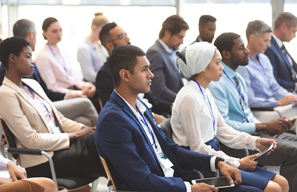 Participants attending an annual general meeting.